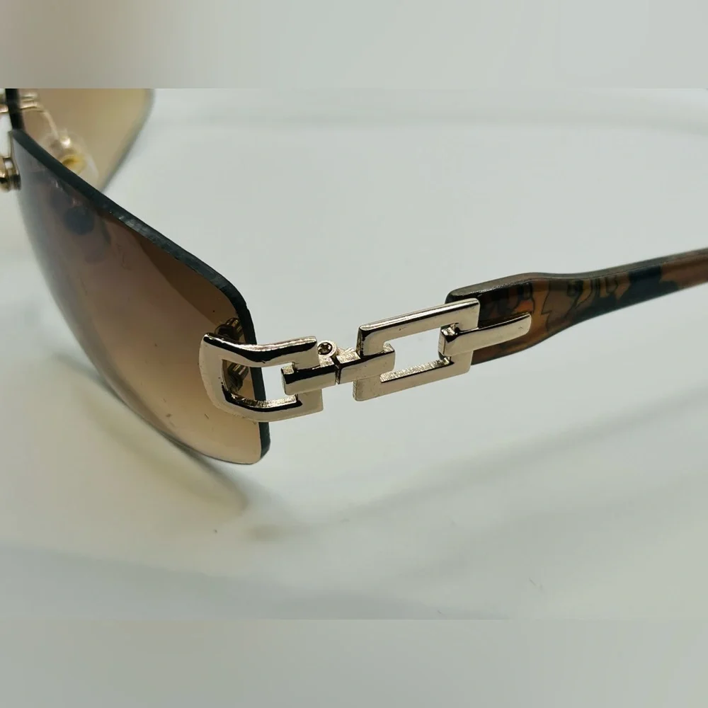 Vintage 90s Y2K Foster Grant Rimless gold link accent Sunglasses